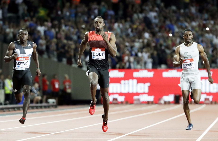 Usain Bolt of Jamaica (centre) runs onto win the men's 200 meter race during the Diamond League anniversary games at the Stadium in the Queen Elizabeth Olympic Park, London on Friday.