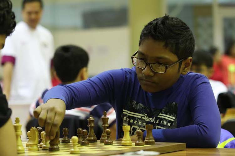 FM Fahad Rahman of Sheikh Russel Memorial Club moves a pawn against Umbetov Kazybek of Uzbekistan during 6th round match of the 14th Dubai Juniors Chess Tournament at Dubai in Arab Emirates on Saturday.