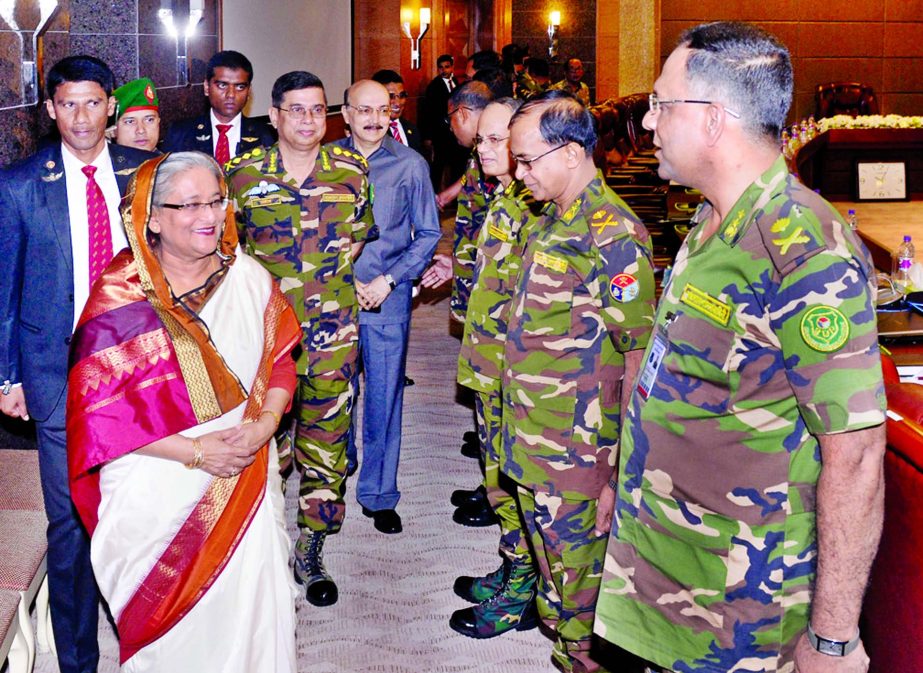 Prime Minister Sheikh Hasina exchanging views with the top-ranking Army officers at Dhaka Cantonment on Sunday.