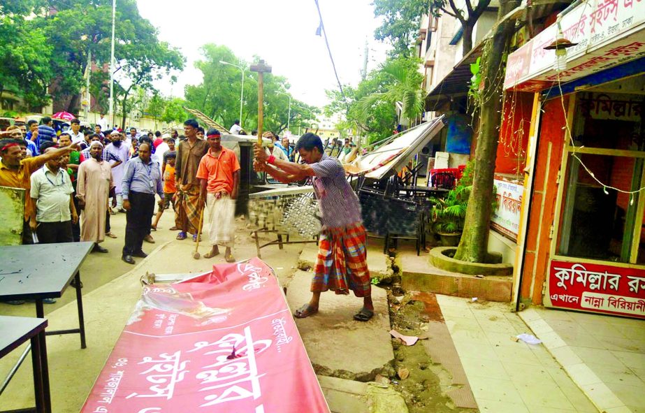 RAJUK launches a drive to dismantle unauthorised commercial structures from residential areas in Uttara as part of govt's decission. This photo was taken on Monday.