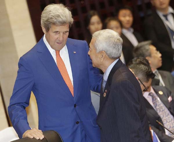 U.S. Secretary of State John Kerry, left, talks to Philippine Foreign Secretary Perfecto Yasay Jr. before the Association of Southeast Asian Nations (ASEAN)-U.S. Foreign Ministers Meeting in Vientiane, Laos on Monday.