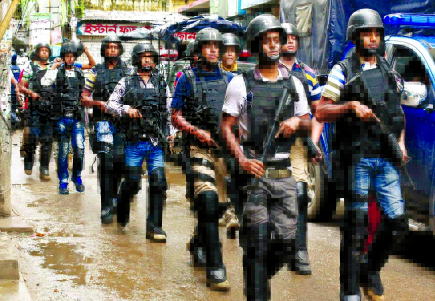 SWAT forces coming out of the Kalynpur hideout of the separatists in the city on Tuesday after operation.