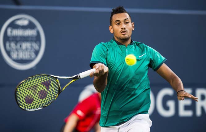 Nick Kyrgios of Australia, returns the ball to Denis Shapovalov of Canada, during men's first round Rogers Cup tennis action in Toronto on Monday.