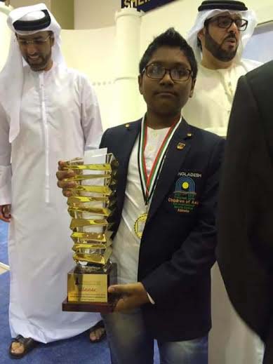 FM Mohammad Fahad Rahman of Sheikh Russel Memorial Chess Club poses with the 14th Dubai Juniors Chess Tournament title at Dubai in United Arab Emirates on Tuesday.