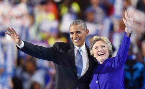 Barack Obama and Hillary Clinton embrace at the Democratic National Convention in Philadelphia.