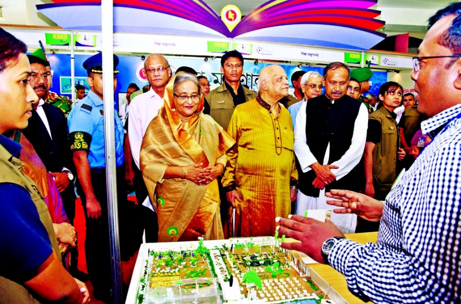 Prime Minister Sheikh Hasina visiting different stalls after inaugurating international summit titled 'Civil Service in Development Innovation-2016' at Bangabandhu Sheikh Mujibur Rahman Novotheater Hall in the city on Thursday. BSS photo