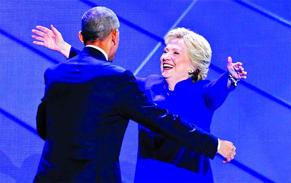 Democratic presidential nominee Hillary Clinton hugs President Barack Obama after she joins him on stage during the third day of the Democratic National Convention in Philadelphia. Internet photo