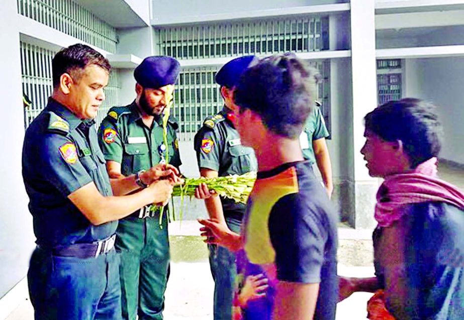 Jail authority of new Central Jail at Keraniganj receiving prisoners of Dhaka Central Jail with flowers on Friday.