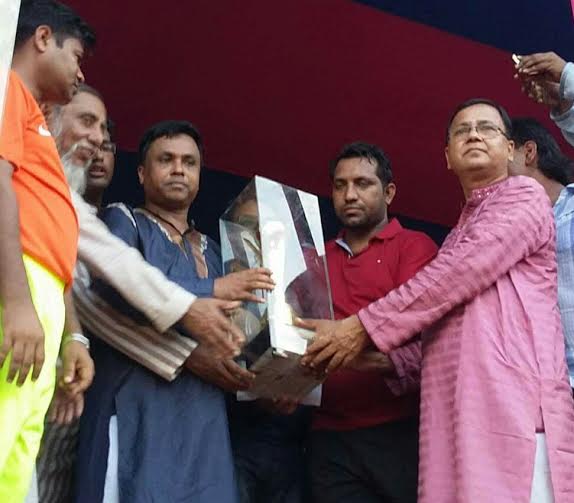 Director of Rupali Bank Limited and Assistant Secretary of the Sub-Committee of Central Awami League Barrister Zakir Ahammad handing over the Gold Cup to Pirkashimpur team, which became champions of the Gold Cup Football at Laur Fatehpur Playing Ground in