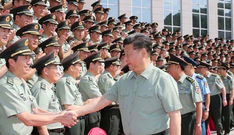 Chinese President Xi Jinping shakes hands with representatives of the PLA Army.