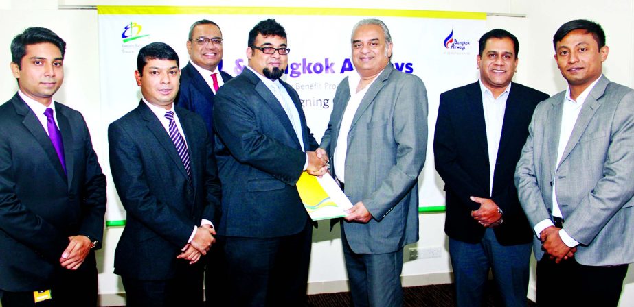 M. Nazeem A. Choudhury, Head of Consumer Banking of Eastern Bank Limited and Rezaul Amin, Chief Commercial Officer, Bangkok Airways, exchanging a MoU documents in Dhaka recently. Under the MoU all card members will enjoy 15 percent discount on airfare for