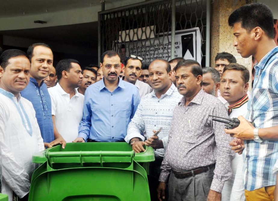 CCC Mayor A J M Nasir Uddin examining dust bins in the Port City recently.