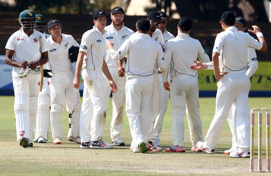 New Zealand's players shake hands with Zimbabwe's batsmen after victory during the fourth day of the first Test match in a series of two tests between New Zealand and Zimbabwe at Queens Sports Club in Bulawayo on Sunday.