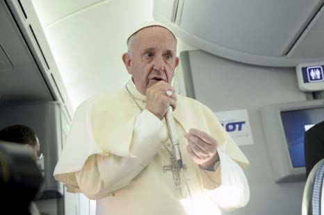 Pope Francis speaks to journalists on board the flight from Krakow, Poland, to Rome, at the end of his 5-day trip to southern Poland on Sunday.