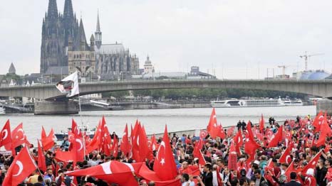 Tens of thousands of Turks living in Germany demonstrated in support of Mr Erdogan in Cologne.