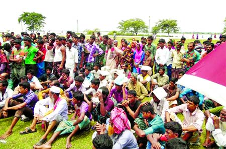 Hundreds of flood victims awaiting for relief in Nilphamari on Tuesday.