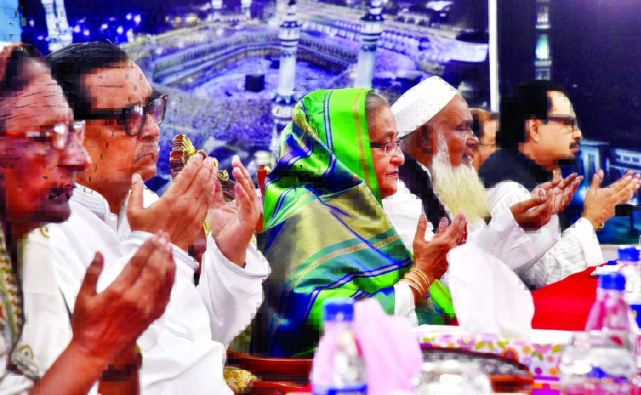 Prime Minister Sheikh Hasina along with other distinguished persons offering Munajat at a Doa Mahfil on the inauguration of Hajj activities at Ashkona Hajj Camp in the city on Wednesday.