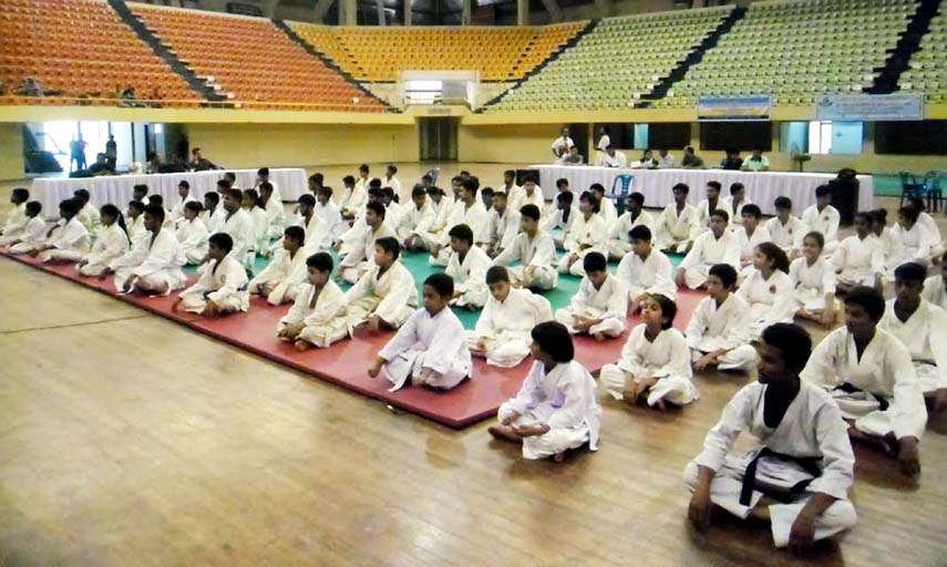 The participants of the First National Gensiriu Karate Competition pose for camera at the Shaheed Suhrawardy Indoor Stadium in Mirpur on Thursday.