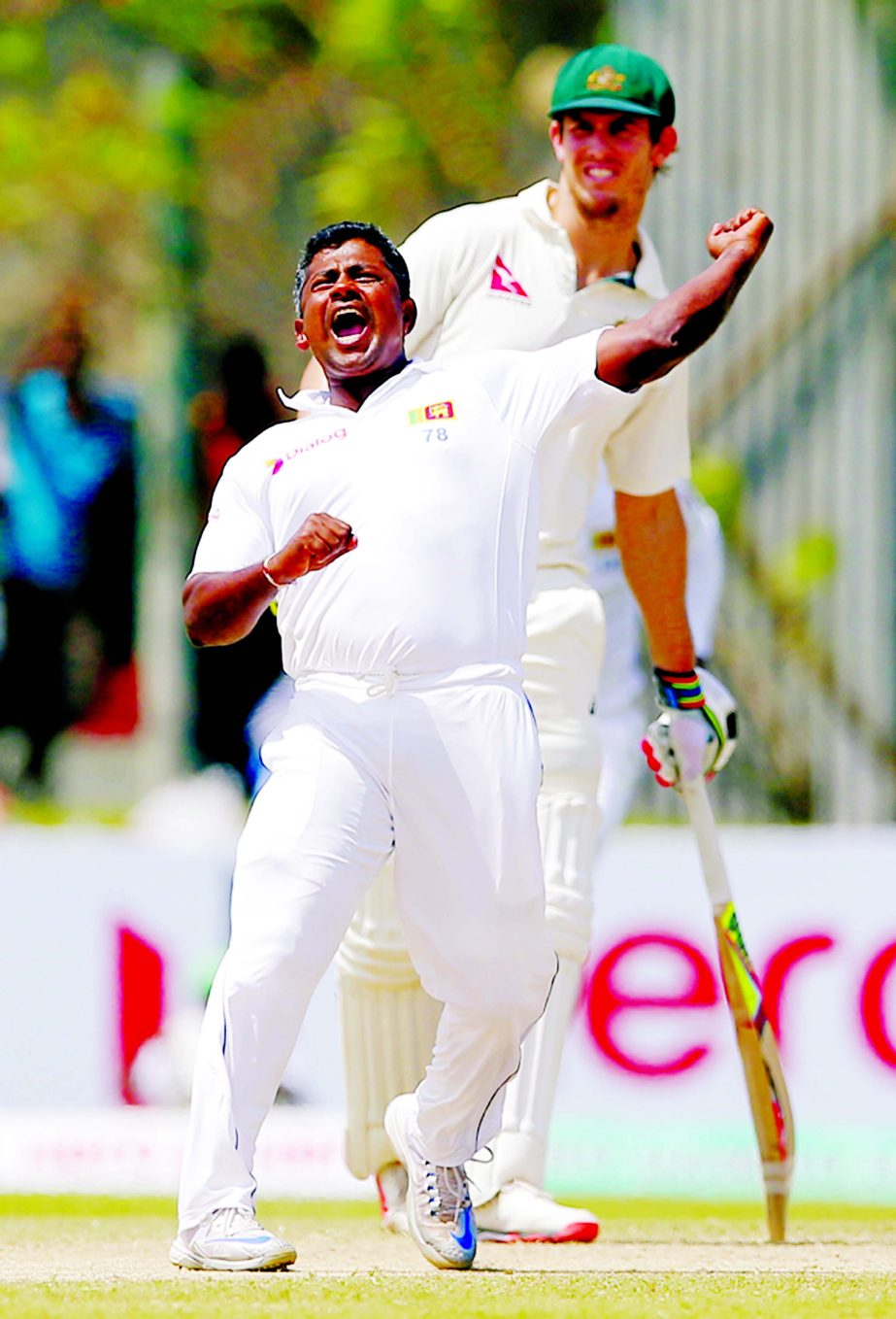 Sri Lanka's Rangana Herath celebrates the wicket of Australia's Peter Nevill as non striker Mitchell Marsh watches on day two of their second Test cricket match in Galle, Sri Lanka on Friday.