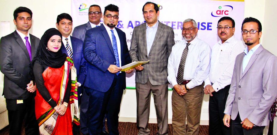 M. Nazeem A. Choudhury, Head of Consumer Banking of Eastern Bank Limited (EBL) and Asif Zafar, CEO of ARC Enterprise- Distributor of Nestle Bangladesh Limited are seen exchanging documents after signing a deal on mutual cooperation.