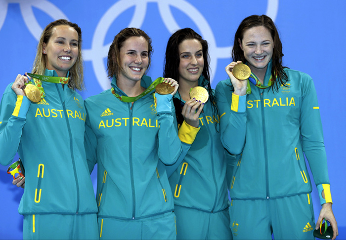 Australia's Emma McKeon (left) Brittany Elmslie (second right) Bronte Campbell (second left) and Cate Campbell (right) show off their gold medals during the ceremony for the women's 4x100-meter freestyle final during the swimming competitions at the 201