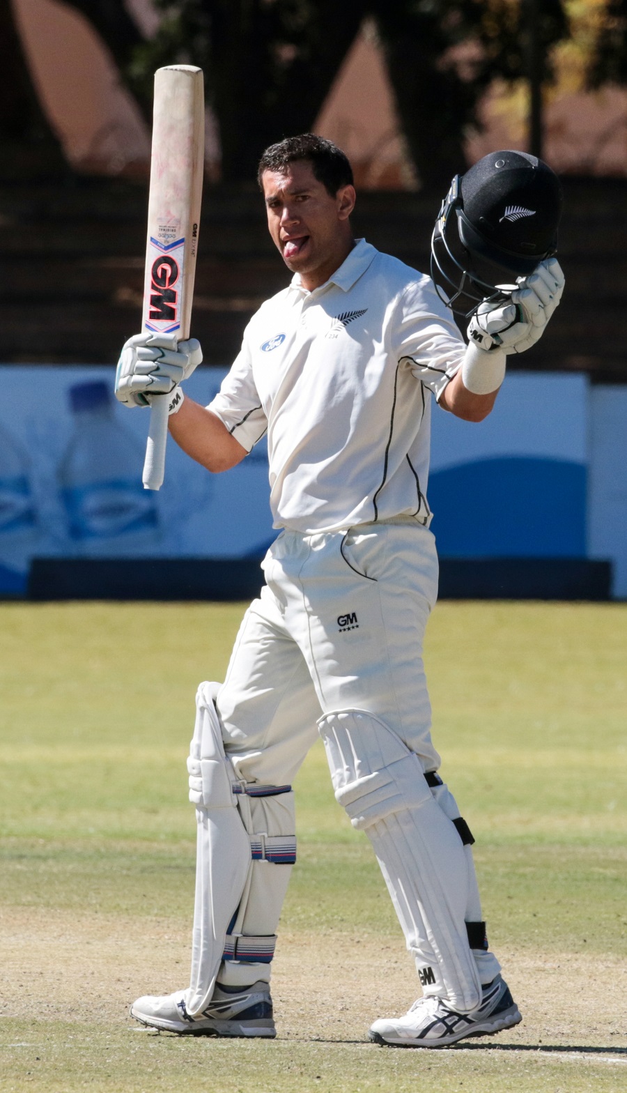 New Zealand batsman Ross Taylor lifts his bat in celebration of his century during the second day of the second Test in a series of two matches between Zimbabwe and New Zealand at the Queens Sports Club in Bulawayo on Sunday.