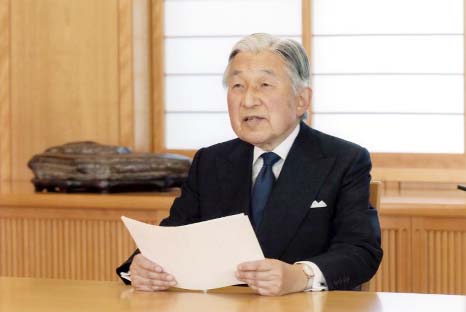 A screen displays Japanese Emperor Akihito delivering a speech in Tokyo on Monday.