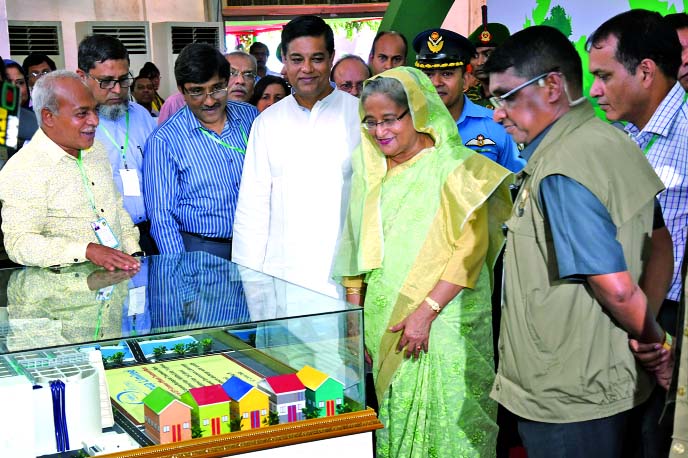 Prime Minister Sheikh Hasina is being briefed on common ETP and environment activities of Tharmex Group Ltd by its Managing Director Abdul Kadir Mollah at Environment Fair-2016, in the city recently.