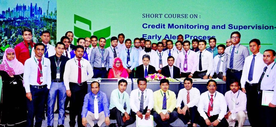 A short course on "Credit Monitoring and Supervision-Early Alert Process" of National Bank Limited held at its Training Institute recently. Choudhury Moshtaq Ahmed, Additional Managing Director of the Bank poses with the participants in the closing cere