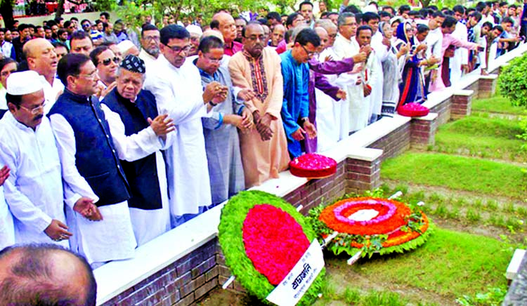 Awami League leaders and activists stand in solemn silence after paying floral tributes to Bangamata Sheikh Fazilatunnessa Mujib at her grave in the city's Banani Graveyard on Monday marking the latter's birthday.