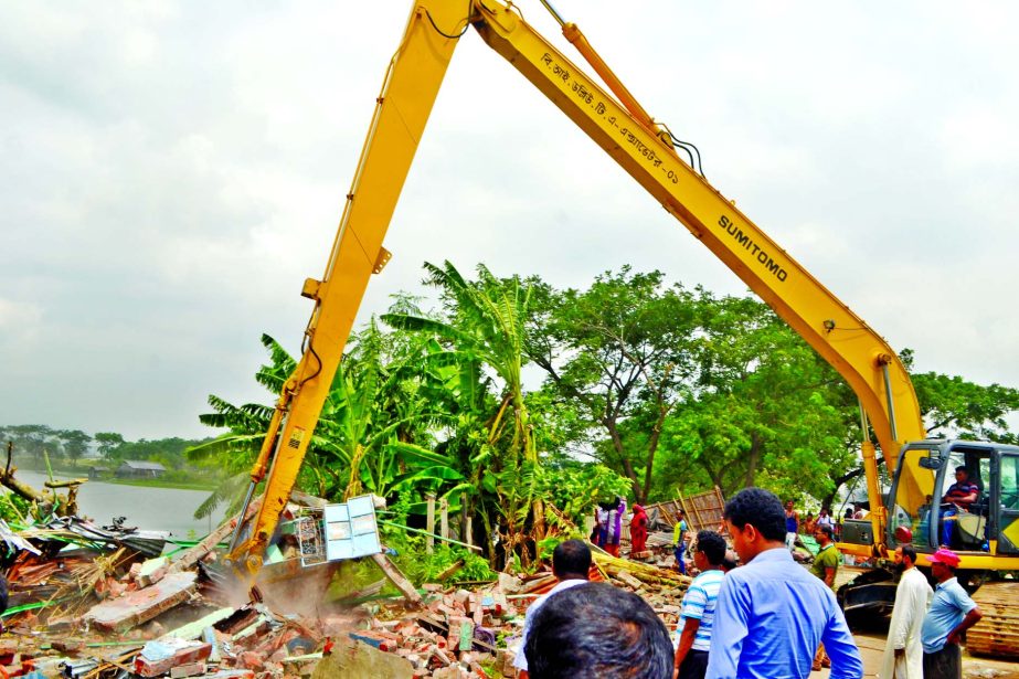 BIWTA authority evicted illegal structures at Keraniganj area along Buriganga River on Monday.