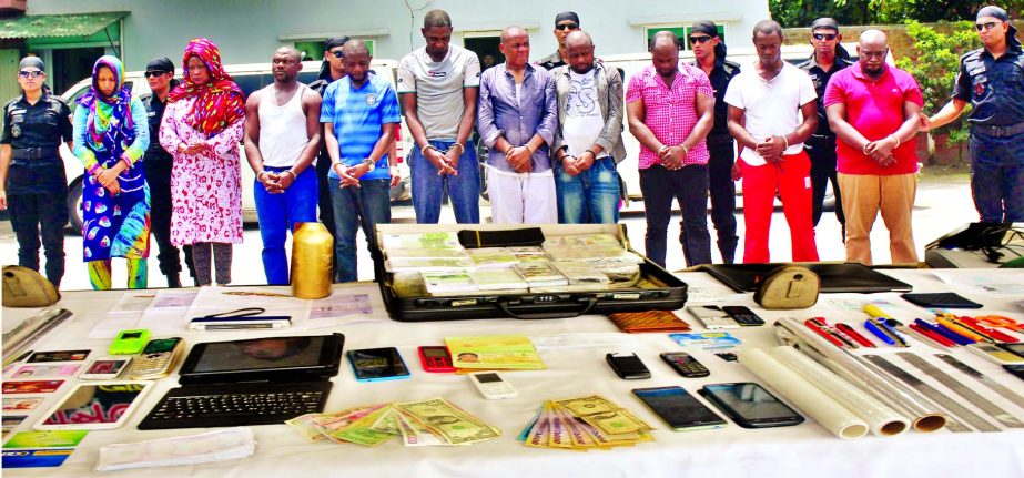 RAB team arrested ten people including 9 foreigners from Bashundhara area of the city with huge fake currency notes and currency-making equipment from their possession on Sunday night.