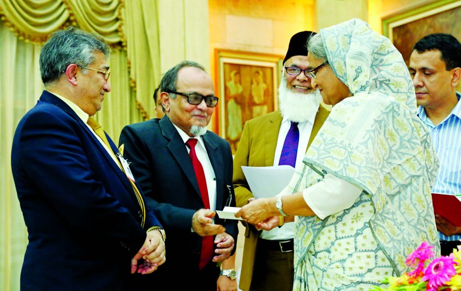 Islami Bank Bangladesh Limited donated Tk.7.5 million to the Prime Minister's Relief and Welfare Fund at Ganobhaban on Tuesday. Prime Minister Sheikh Hasina is seen receiving the cheque from Engr. Mustafa Anwar, Chairman of Islami Bank.