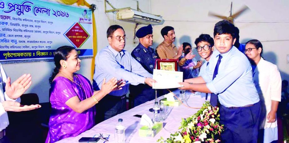 RANGPUR: Kazi Hassan Ahmed, DC, Rangpur distributing crests and certificates among the best stall owners at the concluding ceremony of two- day-long Science and ICT Fair as Chief Guest on Monday.