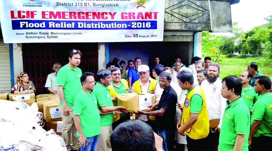 SYLHET: Lions Club International distributing relief materials among the flood-hit people in Mannargaon Union recently.