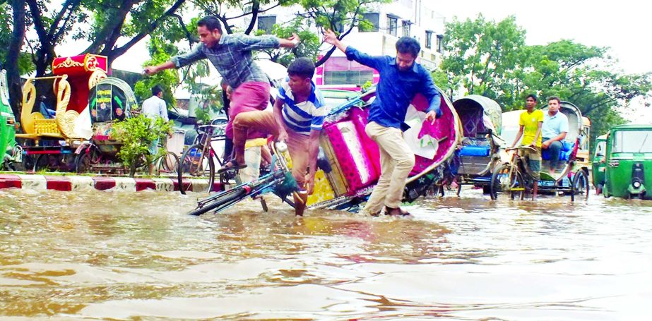 Low-lying areas of Chittagong city were inundated due to incessant rains causing immense sufferings to commuters. This photo was taken from Agrabad area on Wednesday.