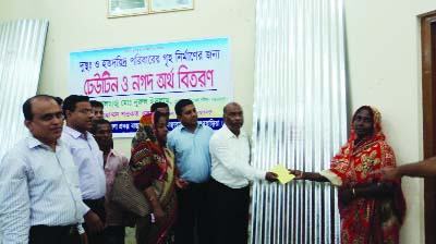 BANCHARAMPUR (Brahmanbaria): Md Nurul Islam, Chairman, Bancharampur Upazila distributing cash money and CI sheet among the flood- hit people of the upazila recently. Among others, Md Shawkat Osman, UNO and Md Mustafa Kamal, Agriculture Officer were pre