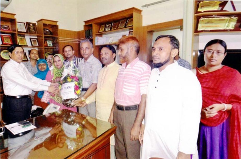 Teachers of the Azizur Rahman Homeopathic Medical College led by its Principal Prof. Dr. Ferdousi Begum presenting bouquet to Deputy Commissioner of Chittagong at his office chamber on Tuesday.