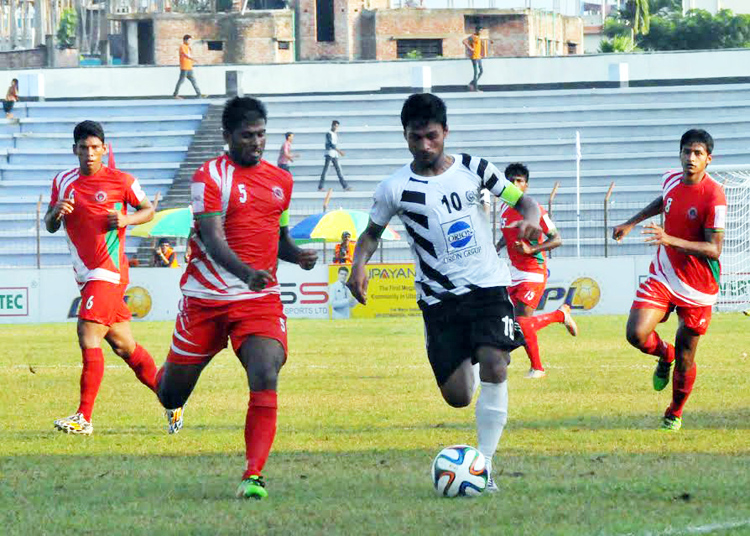 An action from the match of the JB Group BPL Football between Muktijoddha Sangsad Krira Chakra and Dhaka Mohammedan Sporting Club Limited at the Bir Muktijoddha Rafique Uddin Bhuiyan Stadium in Mymensingh on Saturday.