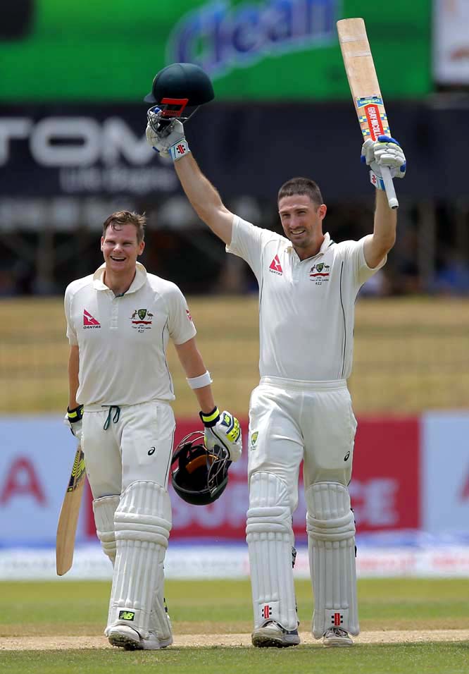 Australia's Shaun Marsh (right) celebrates after scoring a century next to teammate Steve Smith during the third day of their third test cricket match against Sri Lanka in Colombo, Sri Lanka on Monday.