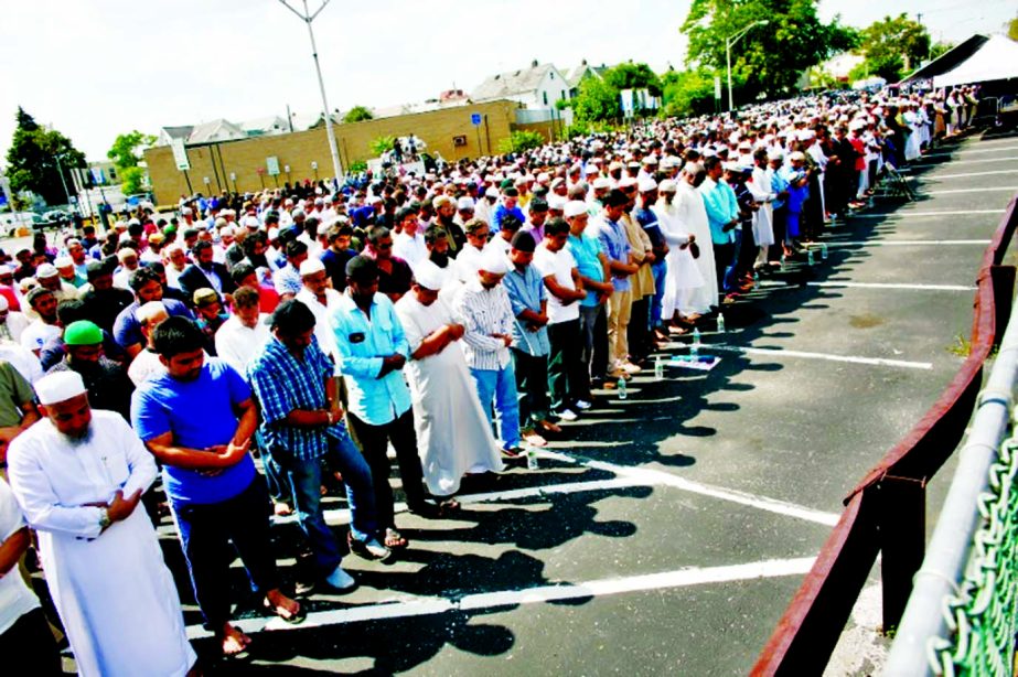 Community members at the Namaz-e- Janaza of Imam Maulana Akonjee and his friend Thara Uddin in New York on Monday.