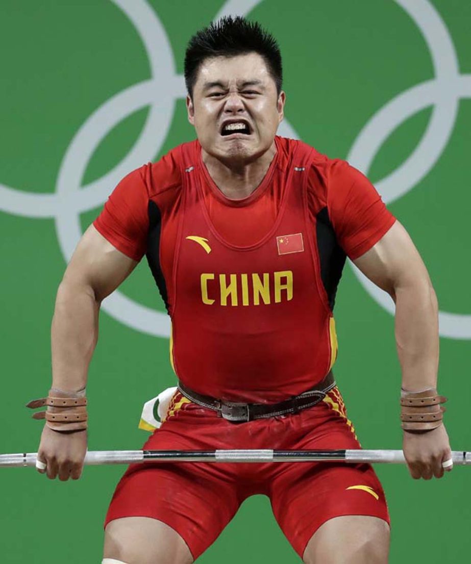 Yang Zhe of China, competes in the men's 105 kg weightlifting event at the 2016 Summer Olympics in Rio de Janeiro, Brazil on Monday.