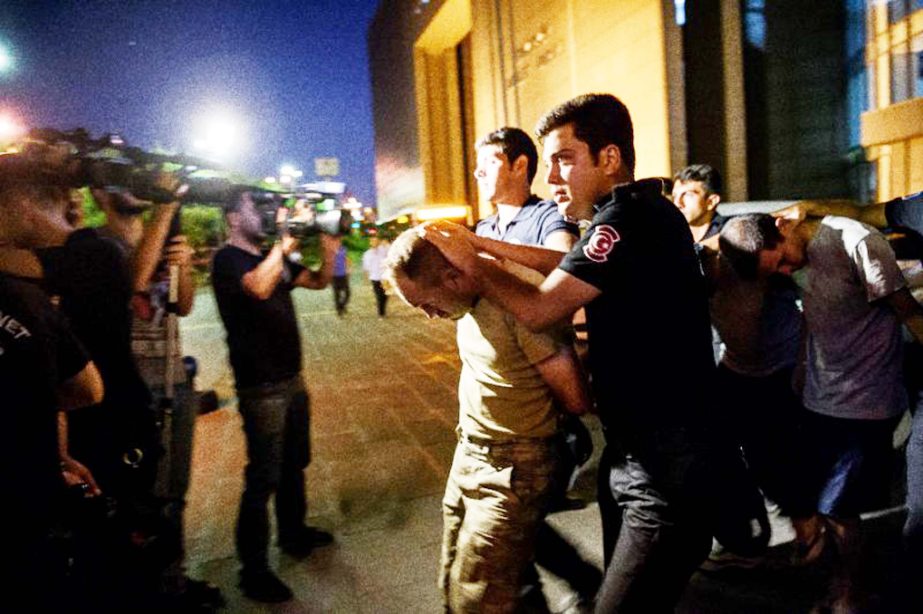 Turkish police escort soldiers who allegedly took part in the attempted coup, from a courthouse in the Bakirkoy district of Istanbul.