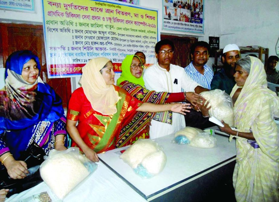 MANIKGANJ: Relief goods are being distributed at Boraid Union in Saturia Upazila organised by Sheule, a social organisation on Tuesday. Among others, Jamila Khatun, District Women Affairs Officer was present in the programme.