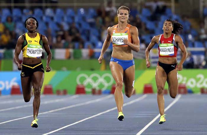 Jamaica's Elaine Thompson, left, and Netherlands' Dafne Schippers, center, compete in a women's 200-meter semifinal during the athletics competitions of the 2016 Summer Olympics at the Olympic stadium in Rio de Janeiro, Brazil, Tuesday.