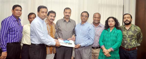 Sumon Barua, College Inspector with other officials handing over HSC result to CCC Mayor A J M Nasir Uddin at his office yesterday.