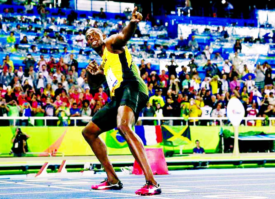 Usain Bolt from Jamaica celebrates after crossing the line to win the gold medal in the men's 200-meter final, during the athletics competitions of the 2016 Summer Olympics at the Olympic stadium in Rio de Janeiro, Brazil on Thursday.