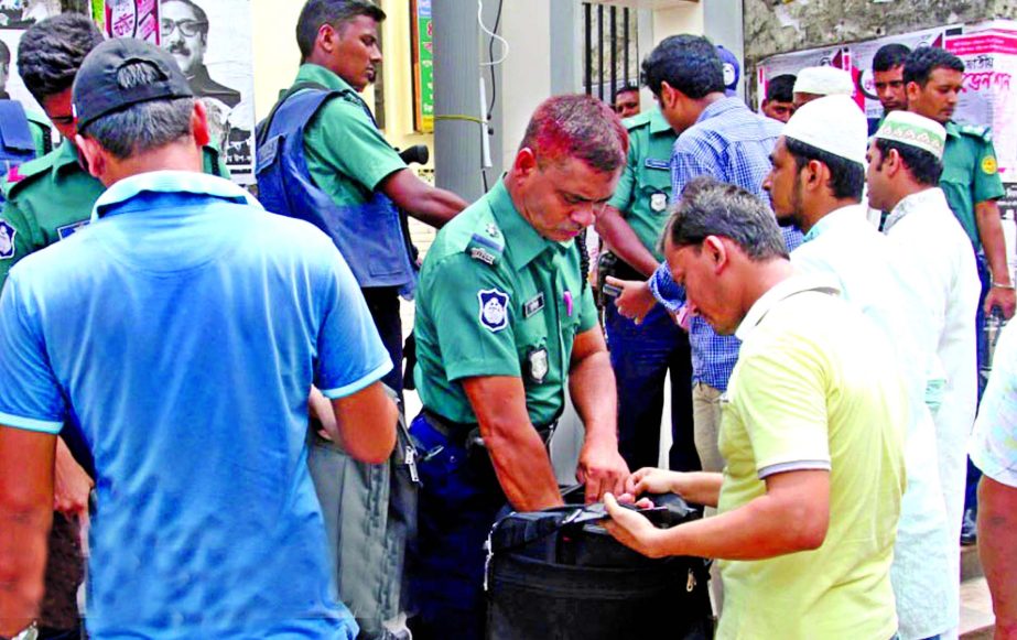 Police searching the bags and bodies of the musallies at the gate of Baitul Mukarram National Mosque on Friday in a bid to avert any untoward incidents.