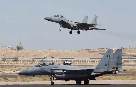 A Saudi F-15 fighter jet lands at the Khamis Mushayt military airbase.