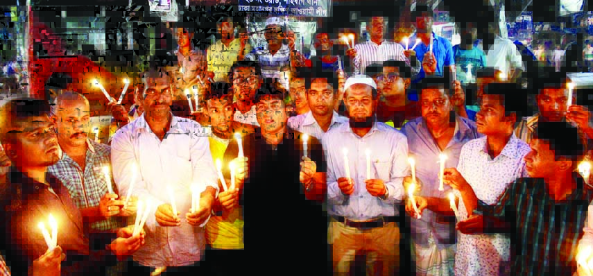 Assistant Secretary of Awami League Sub-Committee Hasibur Rahman Manik, among others, at the candle-lit programme commemorating those who were killed and injured in 21st August grenade attack. The snap was taken from the city's Nur Hossain Chattar on Sat